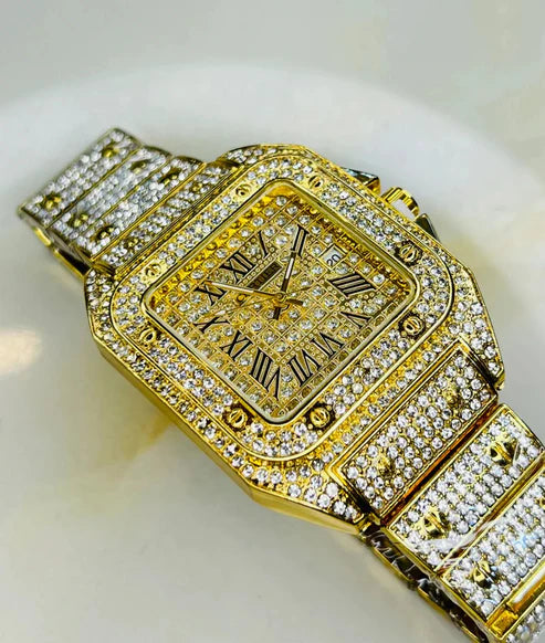 woman gold diamond studed watch